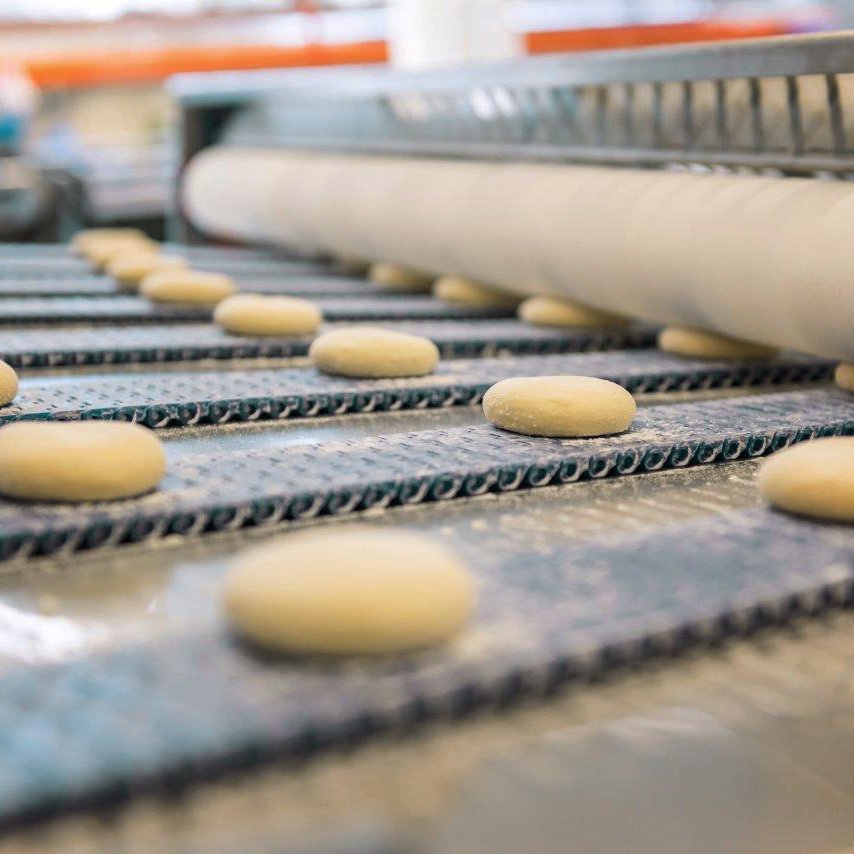 Spreading belt attachment for further transport of the moulded dough balls to following modules Spreading belt attachment