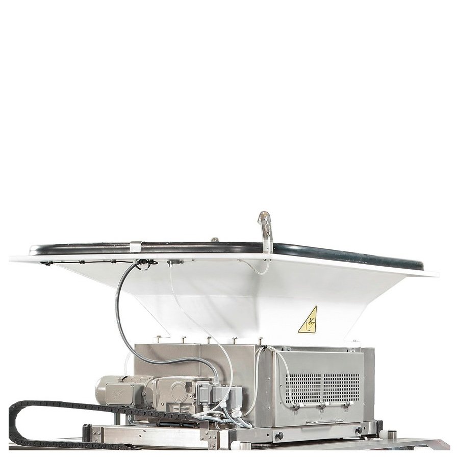 Preportioner - the continuous dough feeding is done by three pairs of rollers. The preportioner can be moved for cleaning and maintenance purposes Preportioner